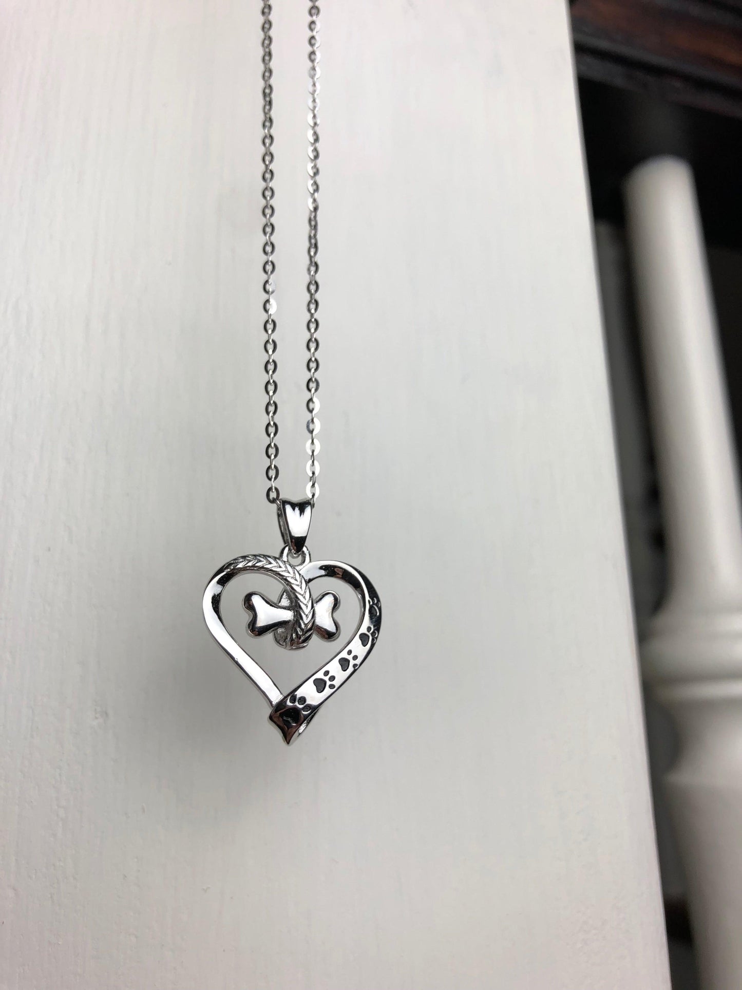 NALA โ Elegant Stainless Steel Necklace with Charming Paw and Heart Design