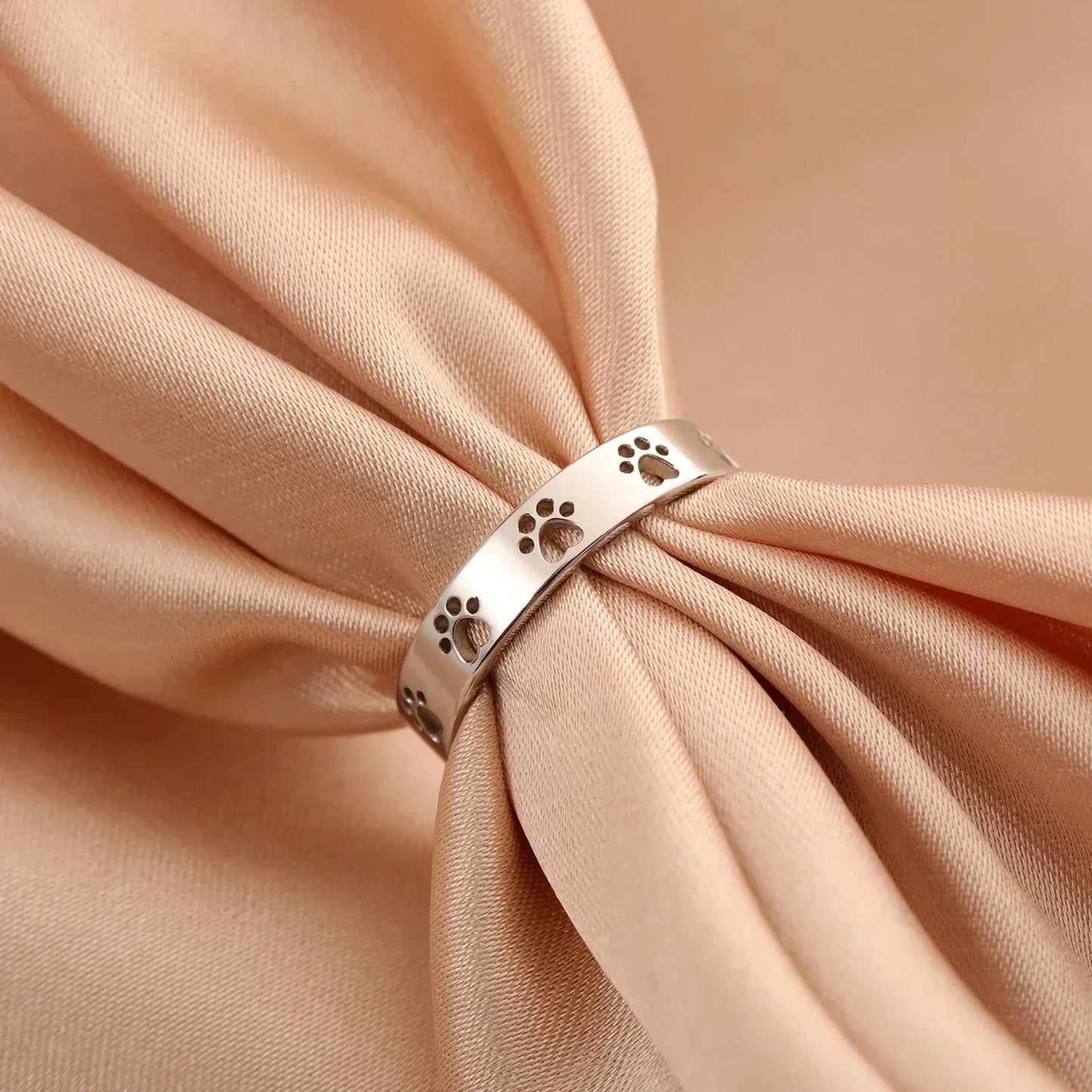 MIRAIE โ Elegant Adjustable Paw Print Ring in Shiny Gold Look Made of High-Quality Stainless Steel