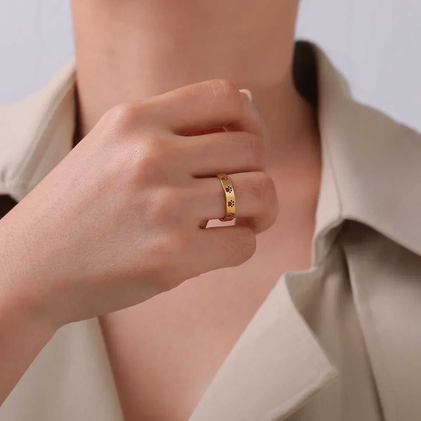 MIRAIE โ Elegant Adjustable Paw Print Ring in Shiny Gold Look Made of High-Quality Stainless Steel