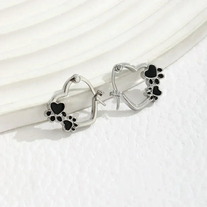 NOVA – Elegant Huggie Earrings with Heart & Paw in Silver Look and Black Enamel for a Stylish Appearance